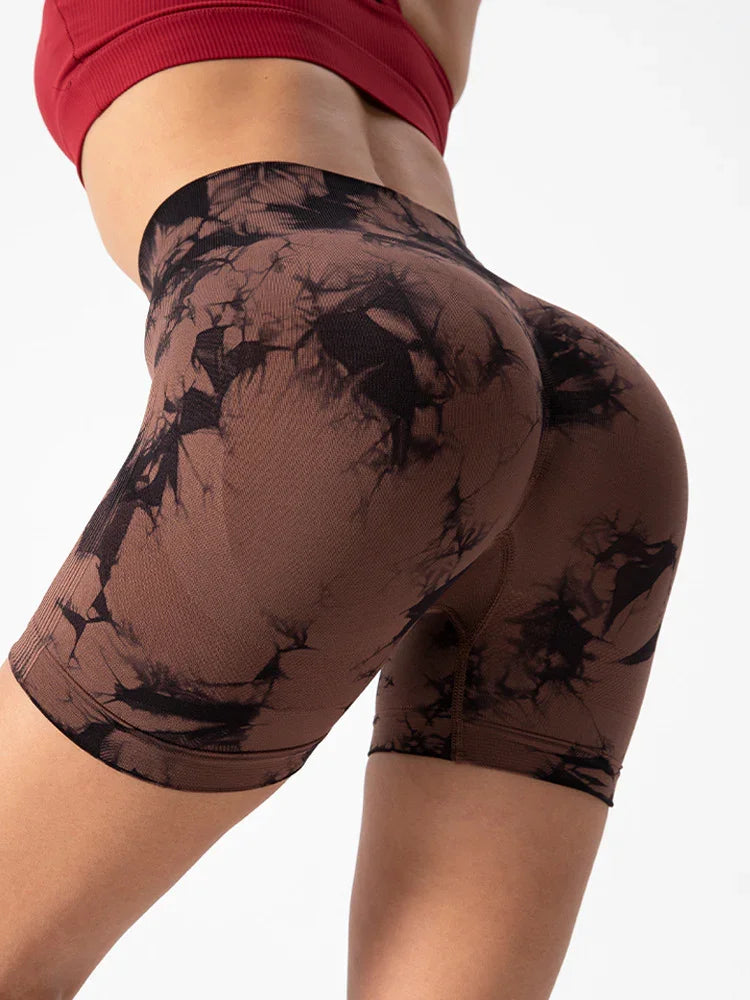 Close-up of woman wearing black and brown tie-dye high-waisted seamless biker shorts with ribbed texture