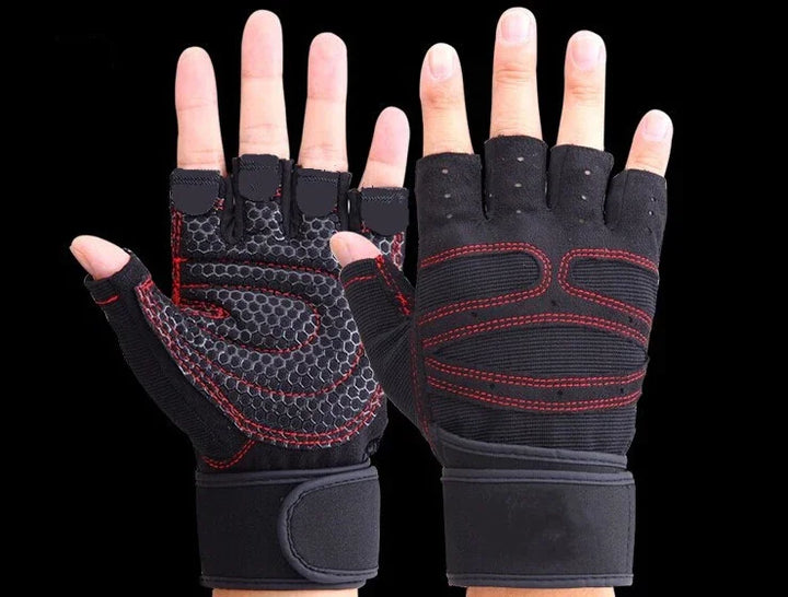 Black fingerless workout gloves with red stitching and wrist straps on hands against black background