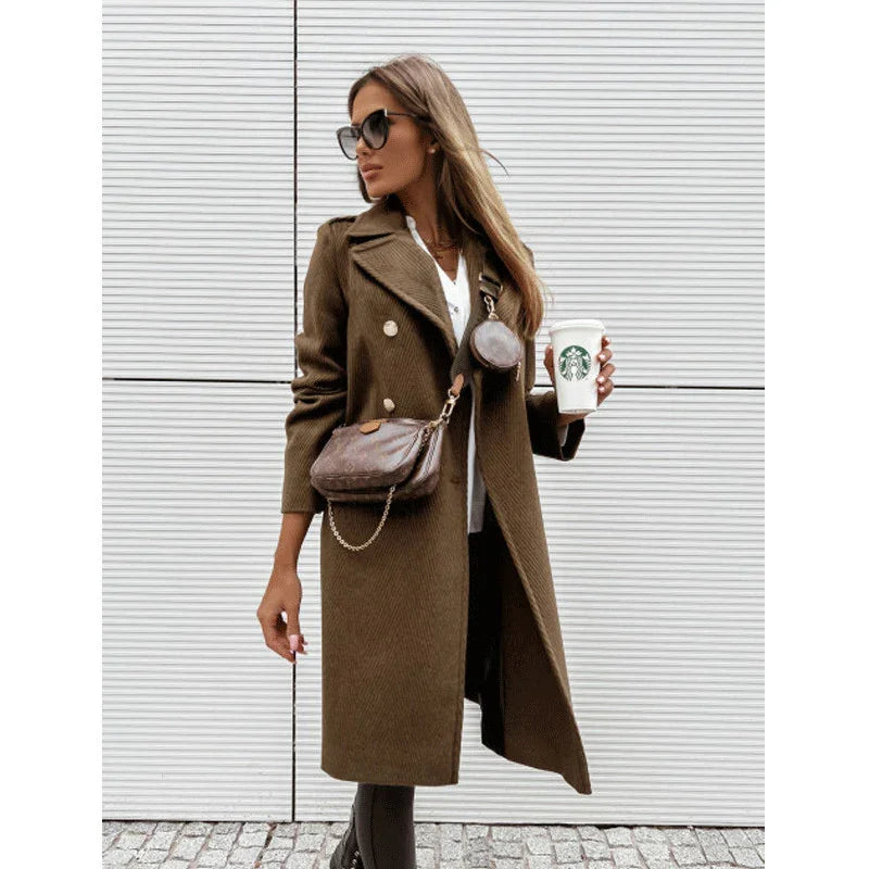 Woman in brown double-breasted coat holding Starbucks cup, wearing crossbody bags and sunglasses