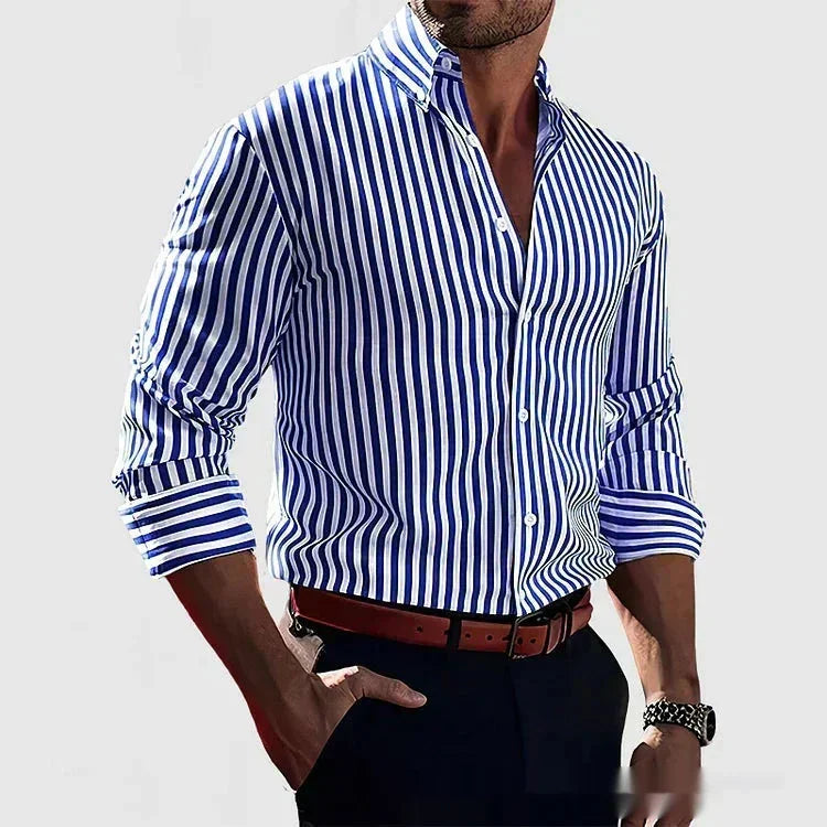 Man wearing blue and white vertical striped button-up shirt with rolled sleeves, brown belt, and black pants