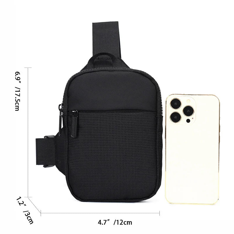 Compact black waist bag with zipper pouch and adjustable strap next to a gold smartphone for size comparison