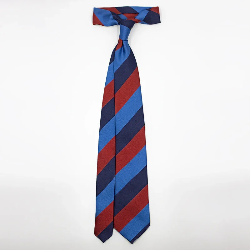 Striped necktie with diagonal red, blue, and navy blue stripes on white background