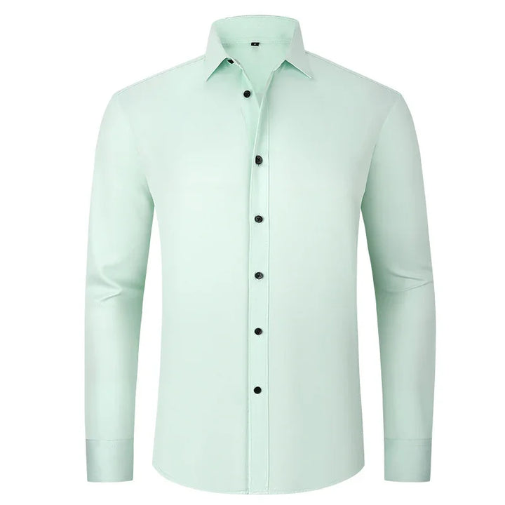 Men's light green dress shirt with black buttons and long sleeves on white background