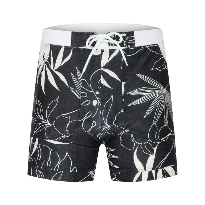 Black and white floral print men's swim trunks with white drawstring and high waistband