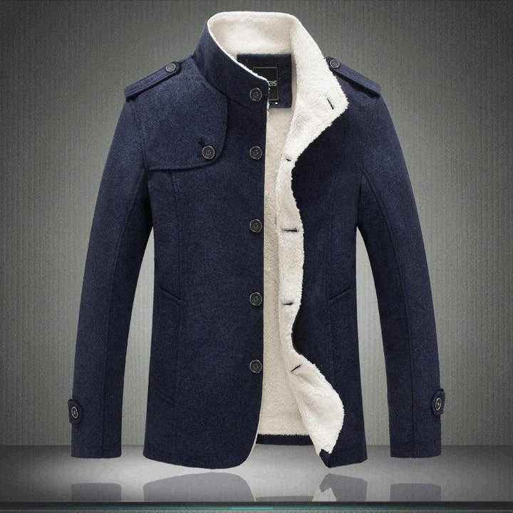 Navy blue men's winter coat with white fleece lining, button closure, and shoulder epaulets