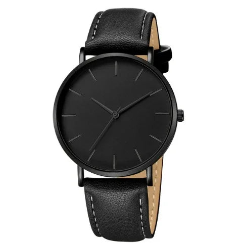 Minimalist black wristwatch with leather strap and simple hour markers