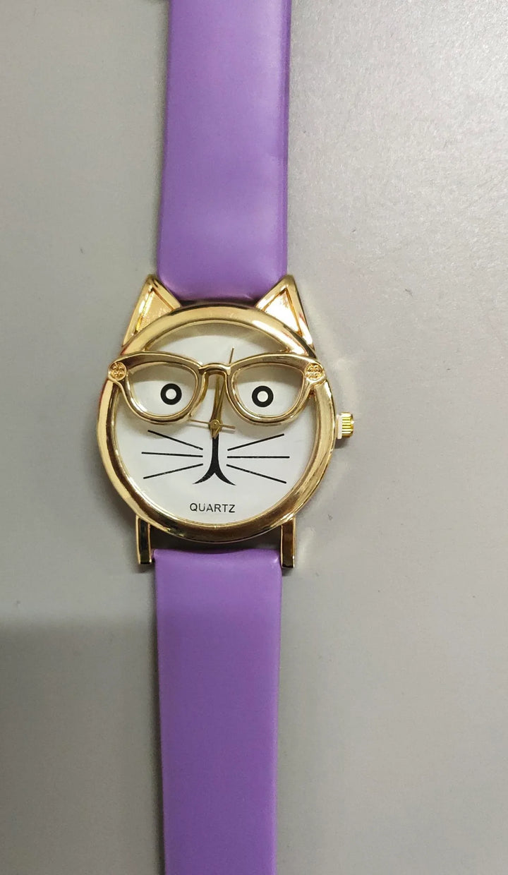 Quartz wristwatch with gold cat face design and glasses on white dial, paired with lavender strap