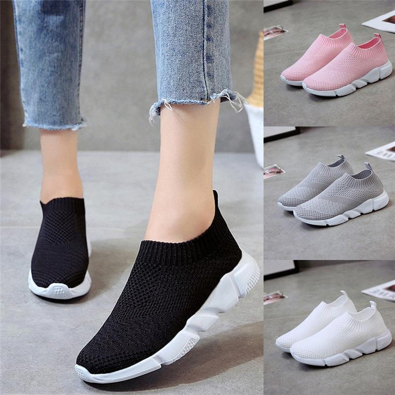 Lightweight slip-on knit sneakers in black, pink, gray, and white with thick white soles
