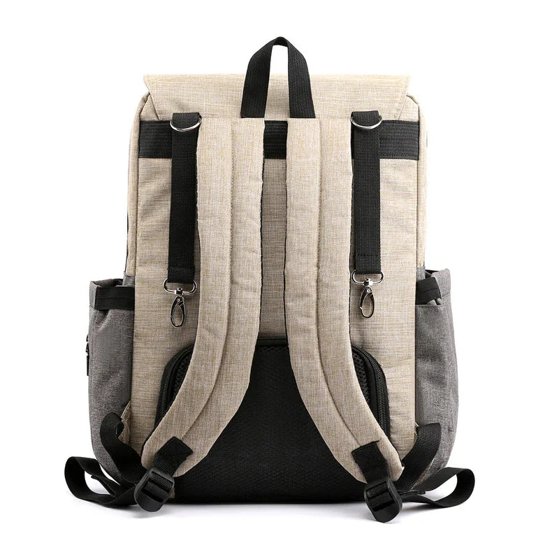 Beige and gray backpack with padded shoulder straps and black accents, back view