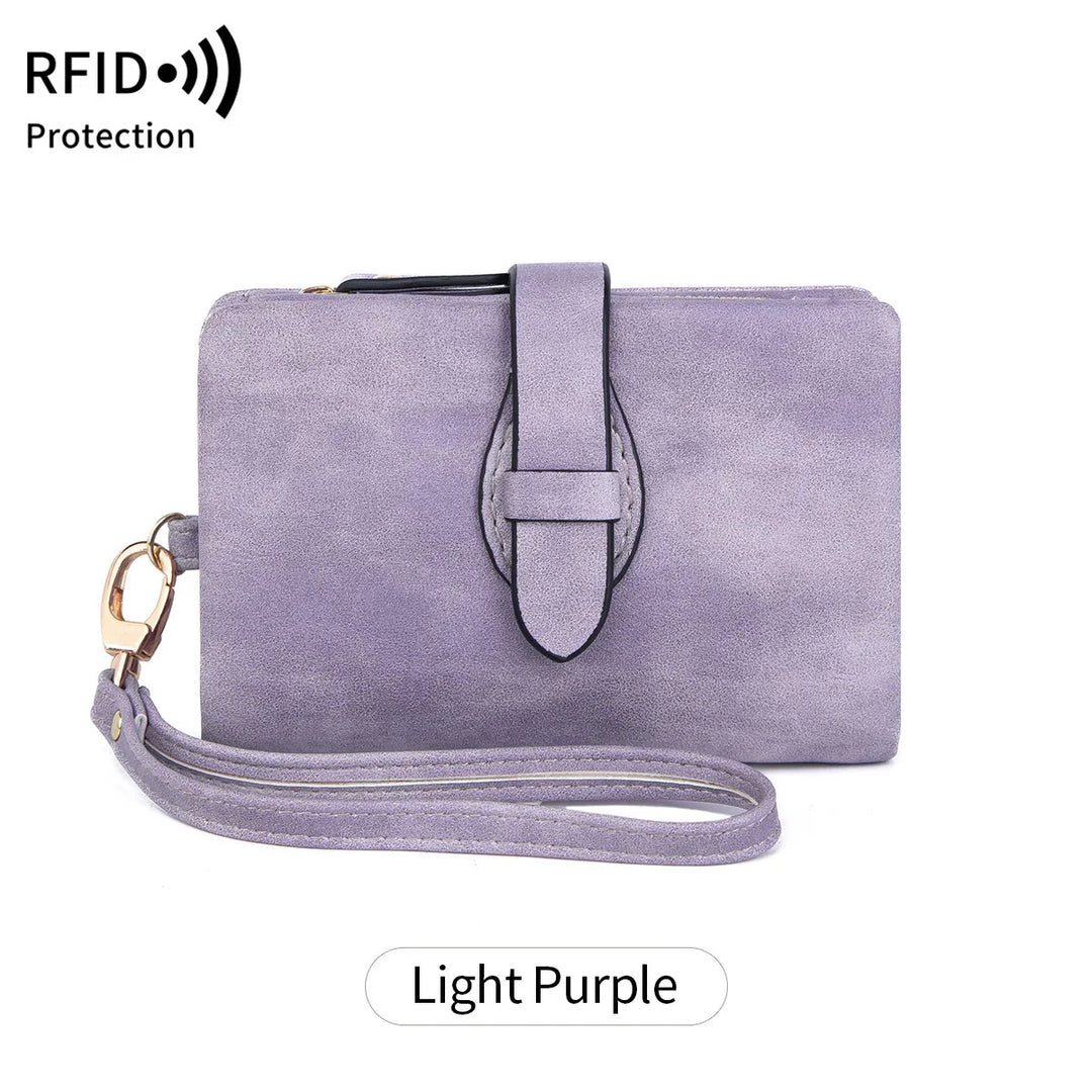 Light purple suede wristlet wallet with strap and RFID protection symbol