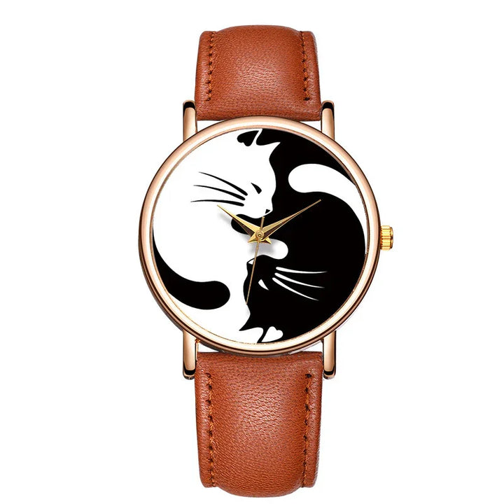 Rose gold watch with brown leather strap and yin-yang design featuring black and white cats