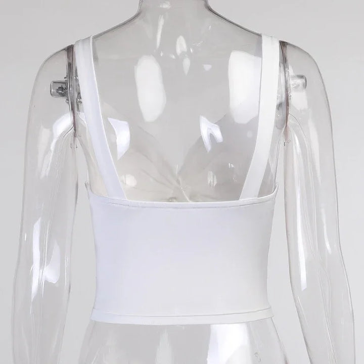 Back view of white cropped tank top with thick straps on transparent mannequin