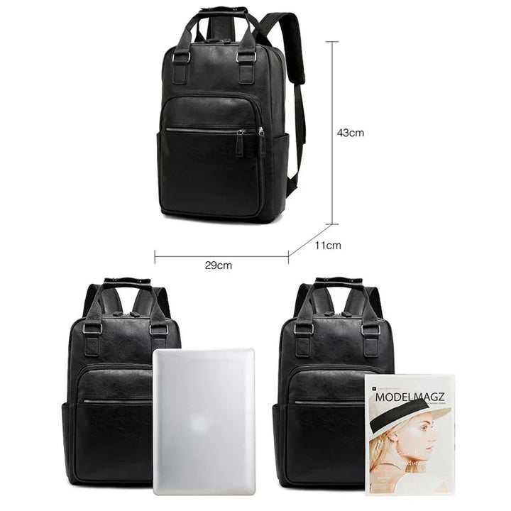 Black leather backpack with zipper pockets and adjustable straps, dimensions 43x29x11cm, shown with laptop and magazine