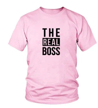 Light pink t-shirt with black text 'THE REAL BOSS' printed on front, casual cotton tee