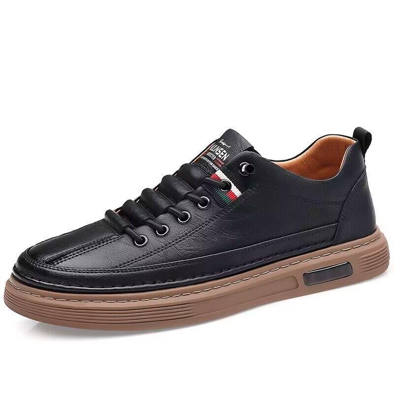 Black leather casual sneaker with brown rubber sole and stitched detailing