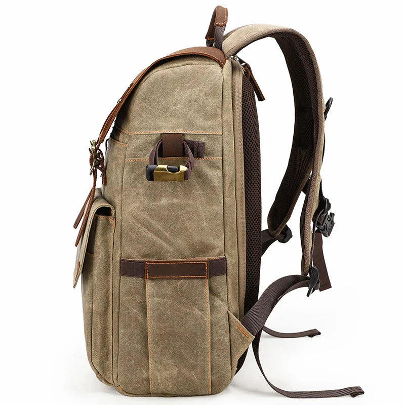 Side view of vintage canvas and leather backpack with multiple pockets and adjustable straps