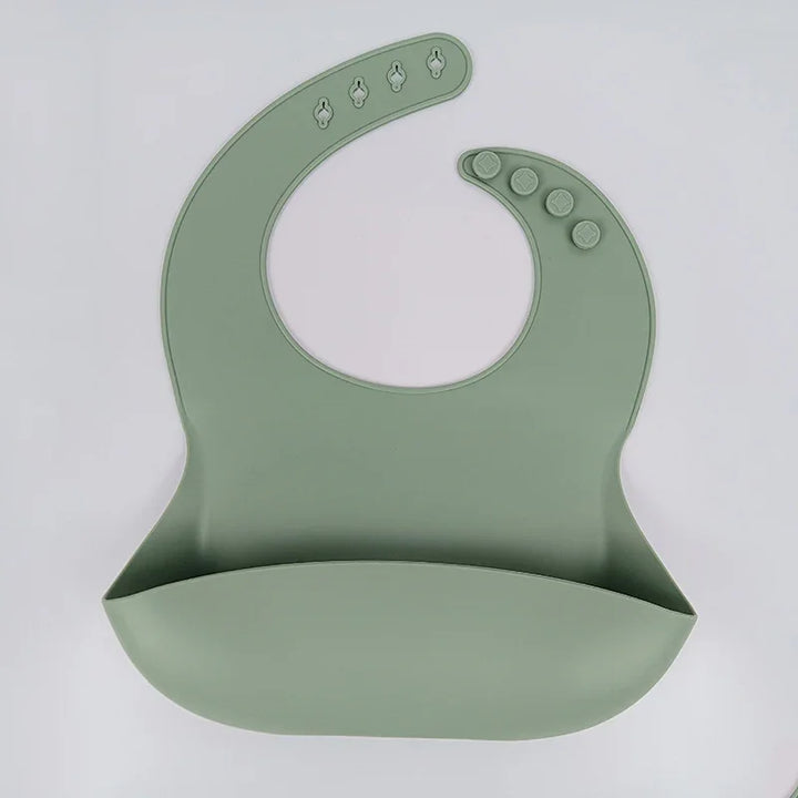 Light green silicone baby bib with adjustable snap buttons and food catcher pocket