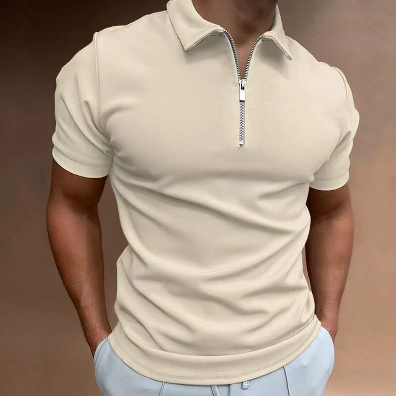Man wearing beige short-sleeve polo shirt with front zipper and light blue pants