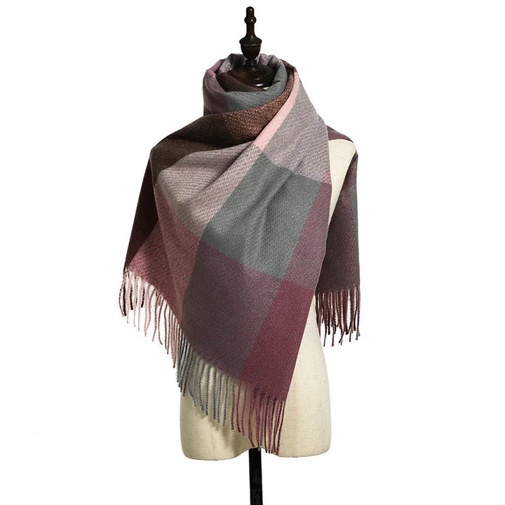 Soft wool scarf with large color blocks in pink, gray, and brown draped on dress form with fringed edges