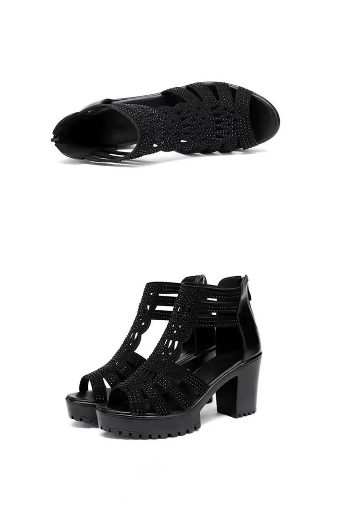 Black high-heeled gladiator sandals with cut-out design and studded details on white background
