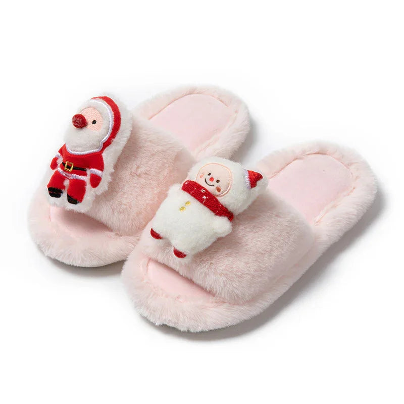 Pink fuzzy slippers with plush Santa Claus and snowman decorations on white background