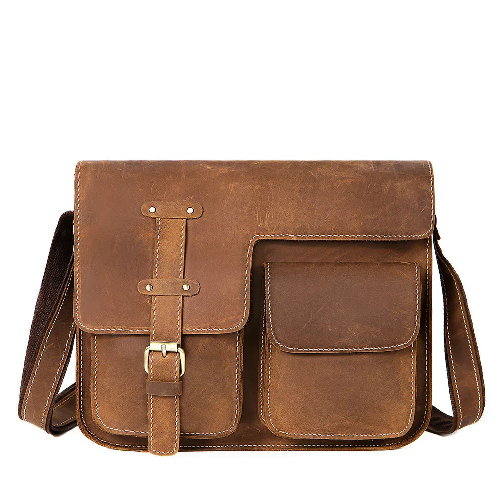 Brown leather messenger bag with front buckle and pocket details, adjustable shoulder strap