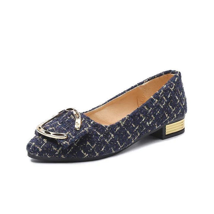 Navy blue tweed flat shoe with gold buckle detail and small stacked gold accented heel