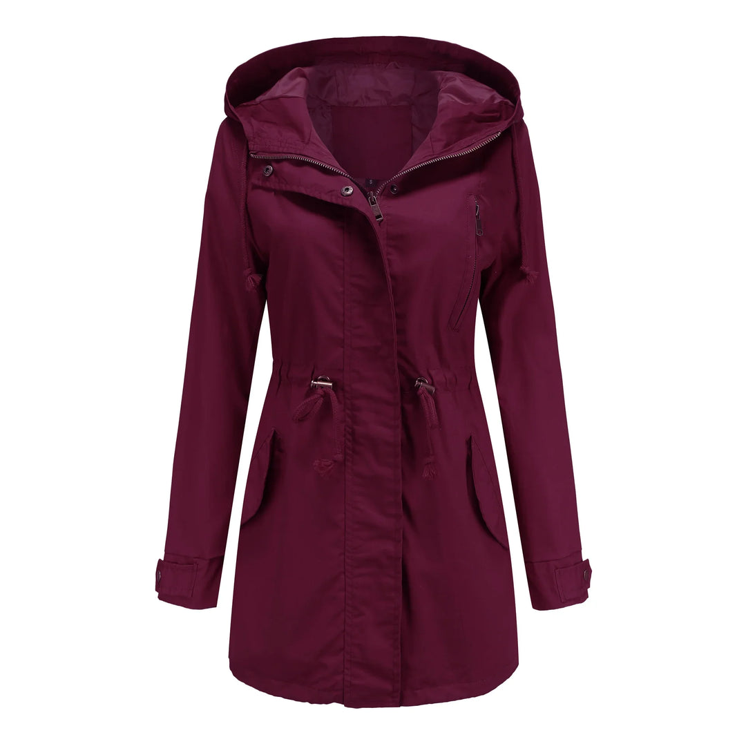 Women's maroon hooded trench coat with zipper, drawstring waist, and flap pockets