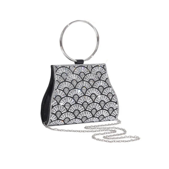 Black evening handbag with silver fan-shaped rhinestone embellishments and silver handle chain