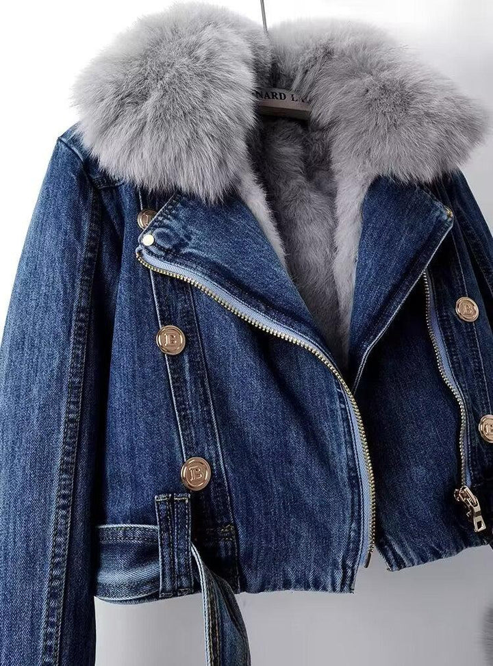 Dark blue denim jacket with large fluffy gray fur collar and gold buttons on hanger