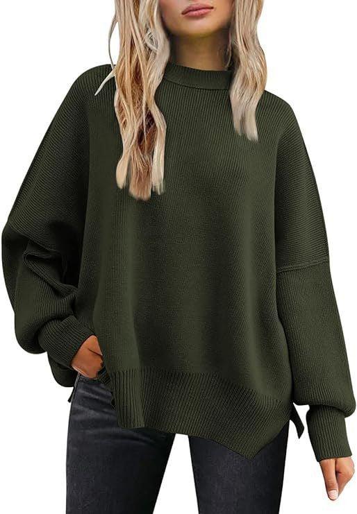 Woman wearing oversized dark green ribbed knit sweater with long sleeves and high neck