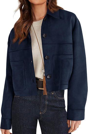 Woman wearing navy blue button-up jacket with front pockets and dark denim jeans