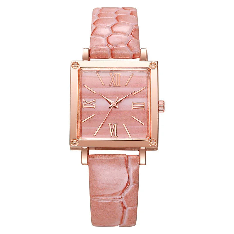 Square rose gold watch with pink textured leather strap and Roman numeral dial