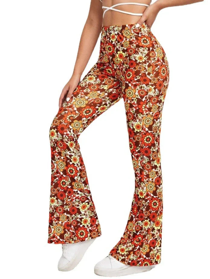 Woman wearing high-waisted retro floral bell-bottom pants in brown, orange, and yellow tones