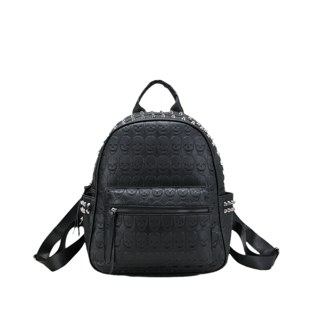 Black leather backpack with embossed skull pattern and silver spike studs on the top and sides