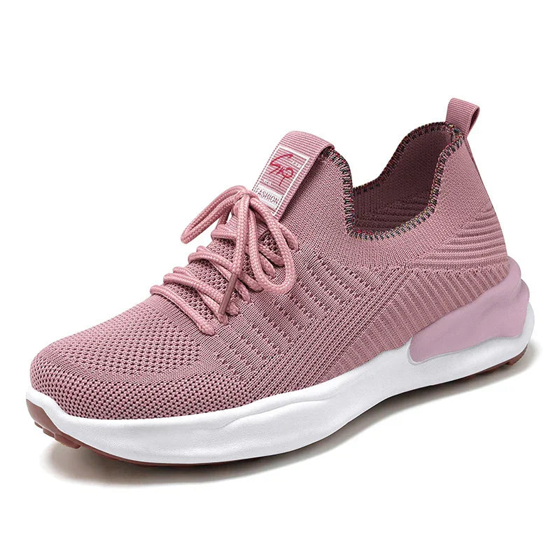 Light pink breathable knit sneaker with white sole and lace-up design