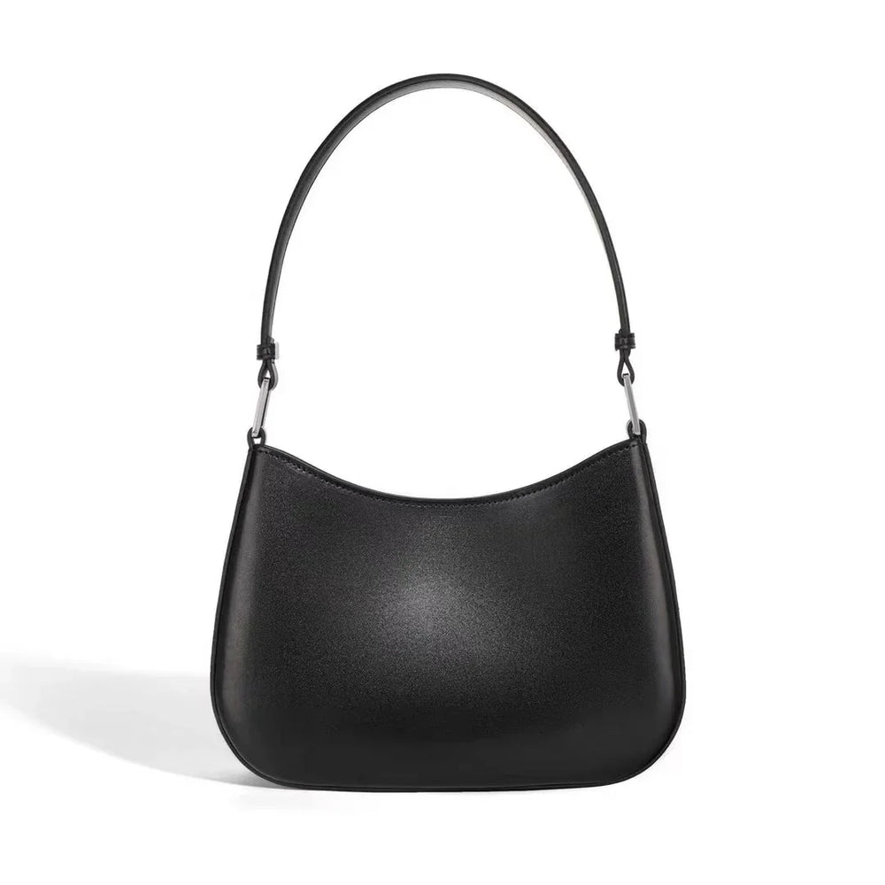 Minimalist black leather shoulder handbag with curved top and single strap