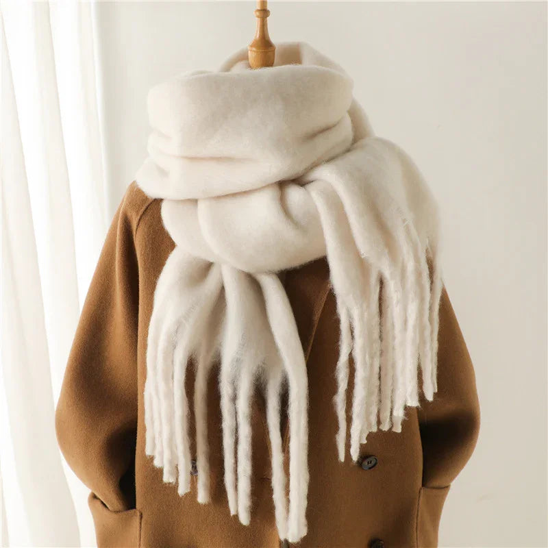 Cozy white wool scarf with fringe on brown double-breasted coat mannequin