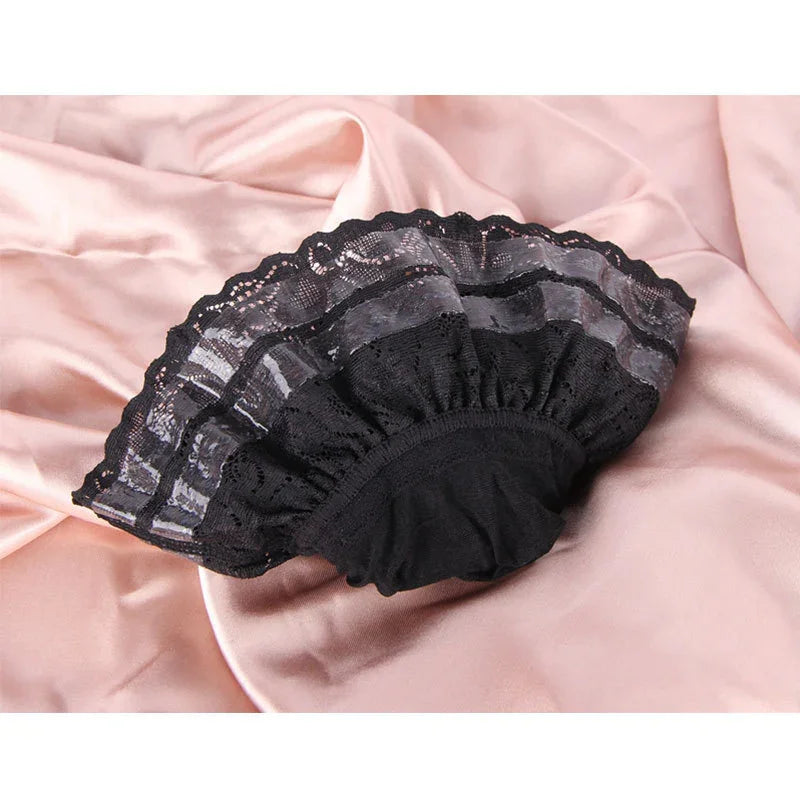 Black lace bonnet with sheer striped details on pink satin fabric