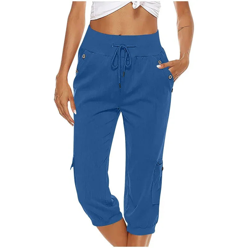 woman wearing blue capri cargo pants with drawstring waist and button details