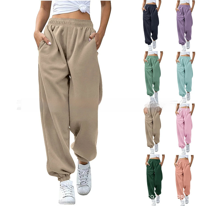 Women wearing casual cotton fleece sweatpants in various colors with elastic waist and pockets