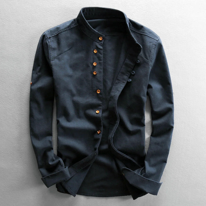Dark navy casual long-sleeve shirt with mandarin collar and brown buttons on light background