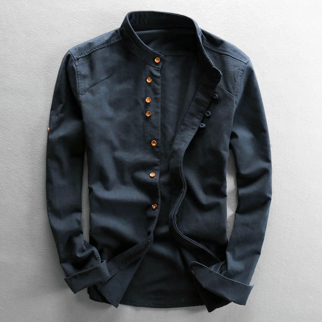 Black long sleeve casual shirt with mandarin collar and brown buttons on gray background
