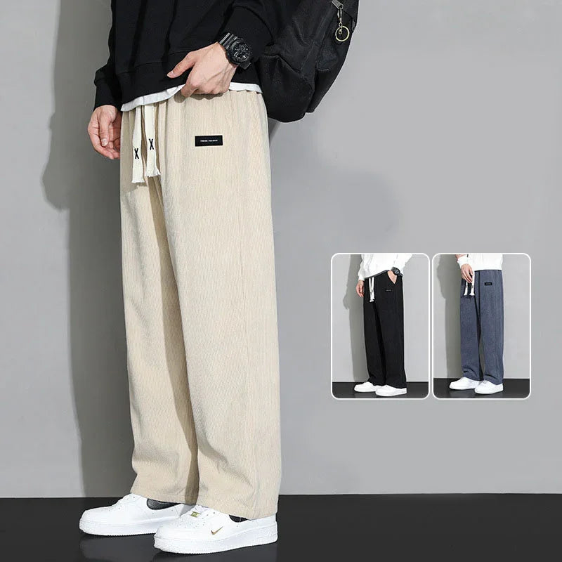 Men's casual wide-leg corduroy pants in beige, black, and navy, styled with white sneakers and black sweatshirt