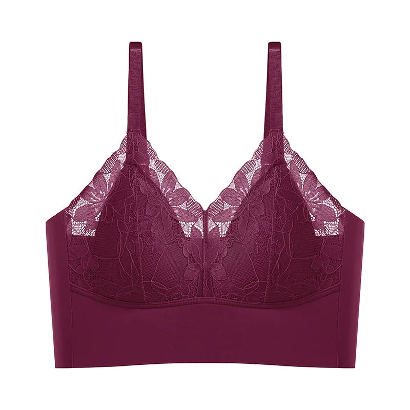 Deep purple lace bralette with floral pattern and adjustable straps on white background