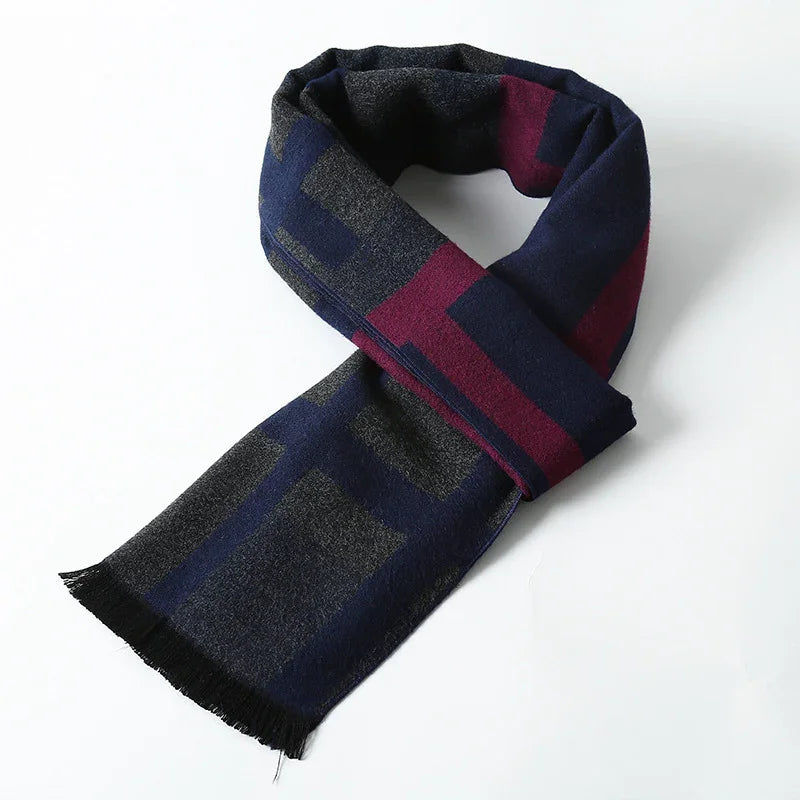 Folded wool scarf with navy blue, burgundy, and gray geometric pattern on white background