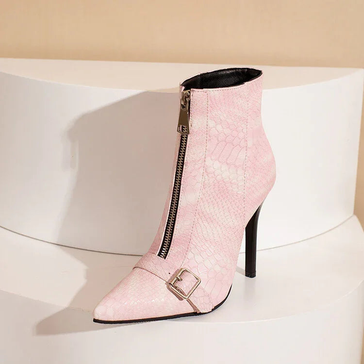 Pink high-heel ankle boot with front zipper, snakeskin texture, and buckle detail