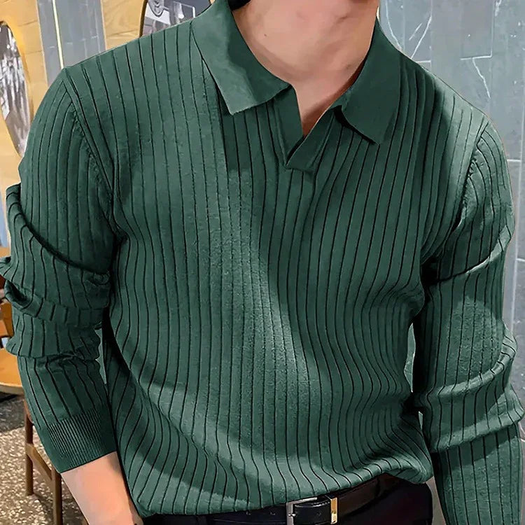 Man wearing dark green ribbed long-sleeve polo shirt with relaxed fit indoors