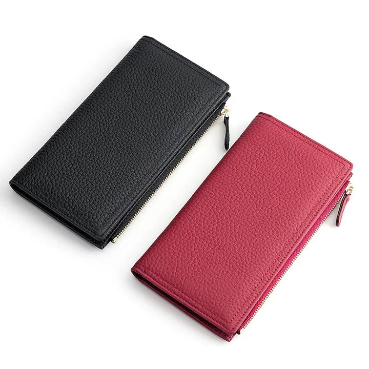 Black and pink textured leather zip-around wallets on white background