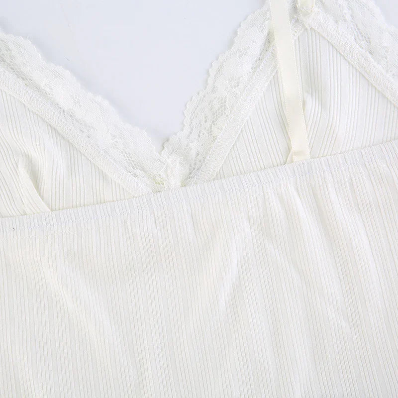 White ribbed fabric camisole featuring delicate lace trim and adjustable strap detail